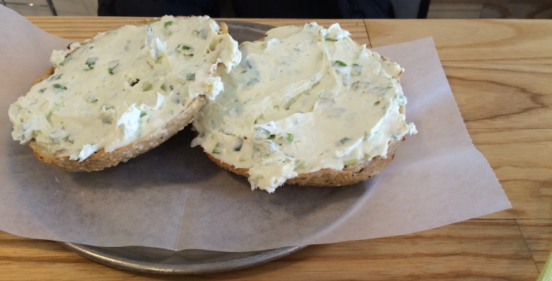 Onion bagel with scallion cream cheese.